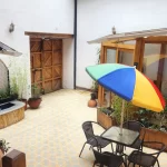 Detailed view of the furnished outdoor courtyard at Casa Tierra