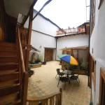 Outdoor courtyard dining area with 4-person table at Casa Tierra