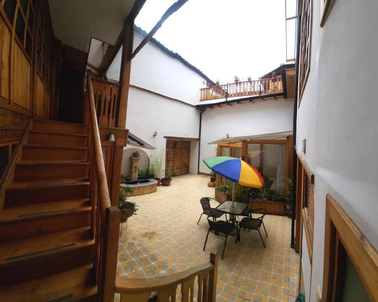Outdoor courtyard dining area with 4-person table at Casa Tierra