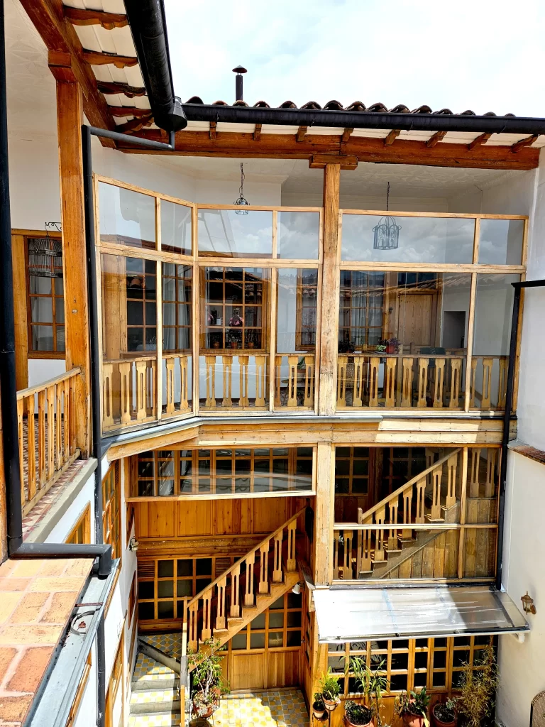 Restored courtyard solarium with sliding glass door and gas firepit
