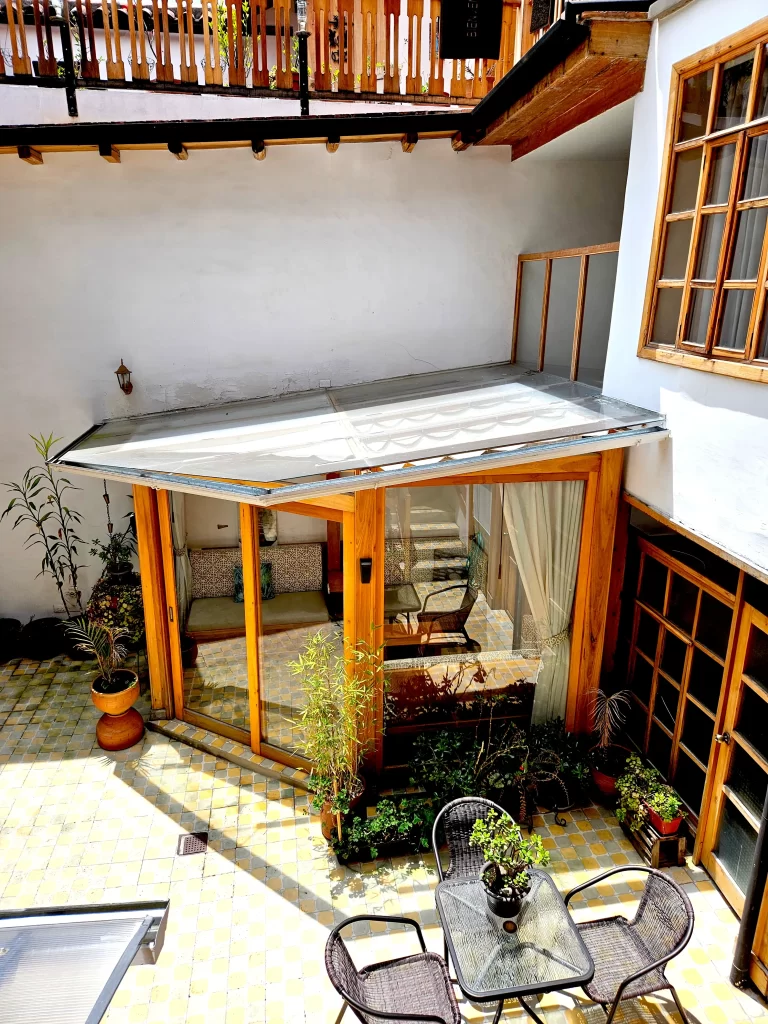 Climate-controlled solarium with interior fabric light diffusion shades