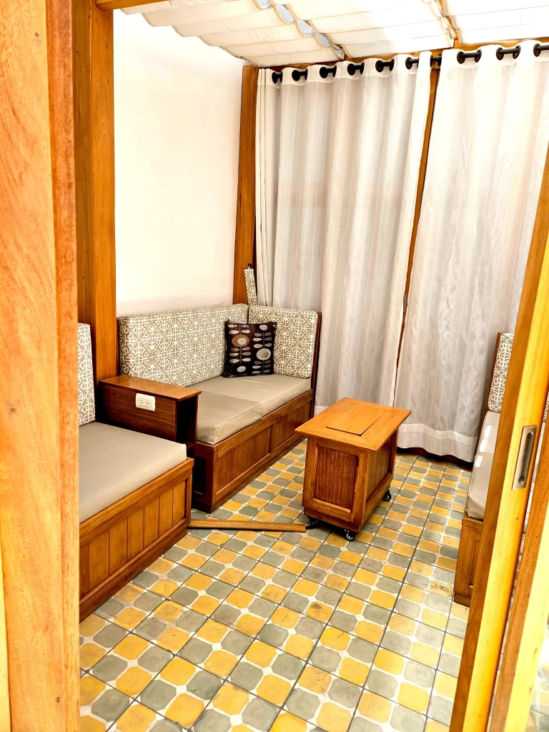 El Invernadero fixed-roof glass solarium and enclosed courtyard lounge