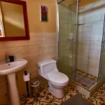 Modern bathroom with updated fixtures in the Morgan Suite furnished apartment