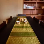Dining area with table and chairs in the Morgan Suite furnished apartment